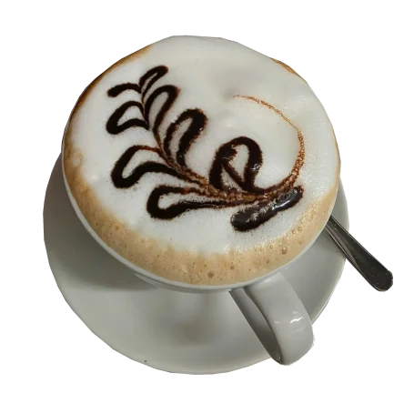 Eine Tasse Cappuccino mit einer dekorativen Schokoladensauce auf der Oberfläche.