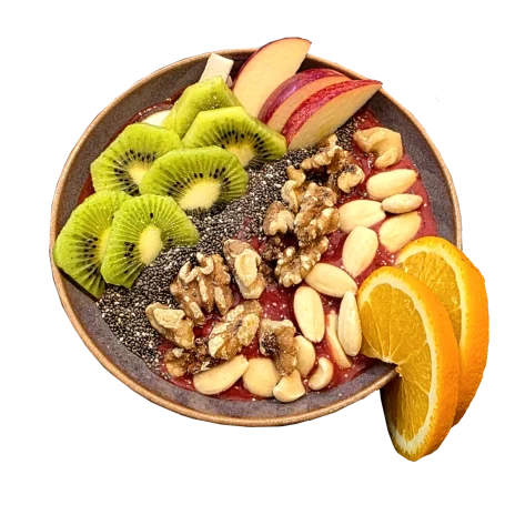 Bunte Smoothie Bowl mit Früchten und Crunch-Topping.
